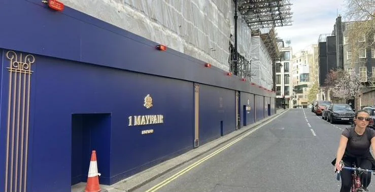 Mayfair hoarding, photo 1: Hoarding clad with built-up letters